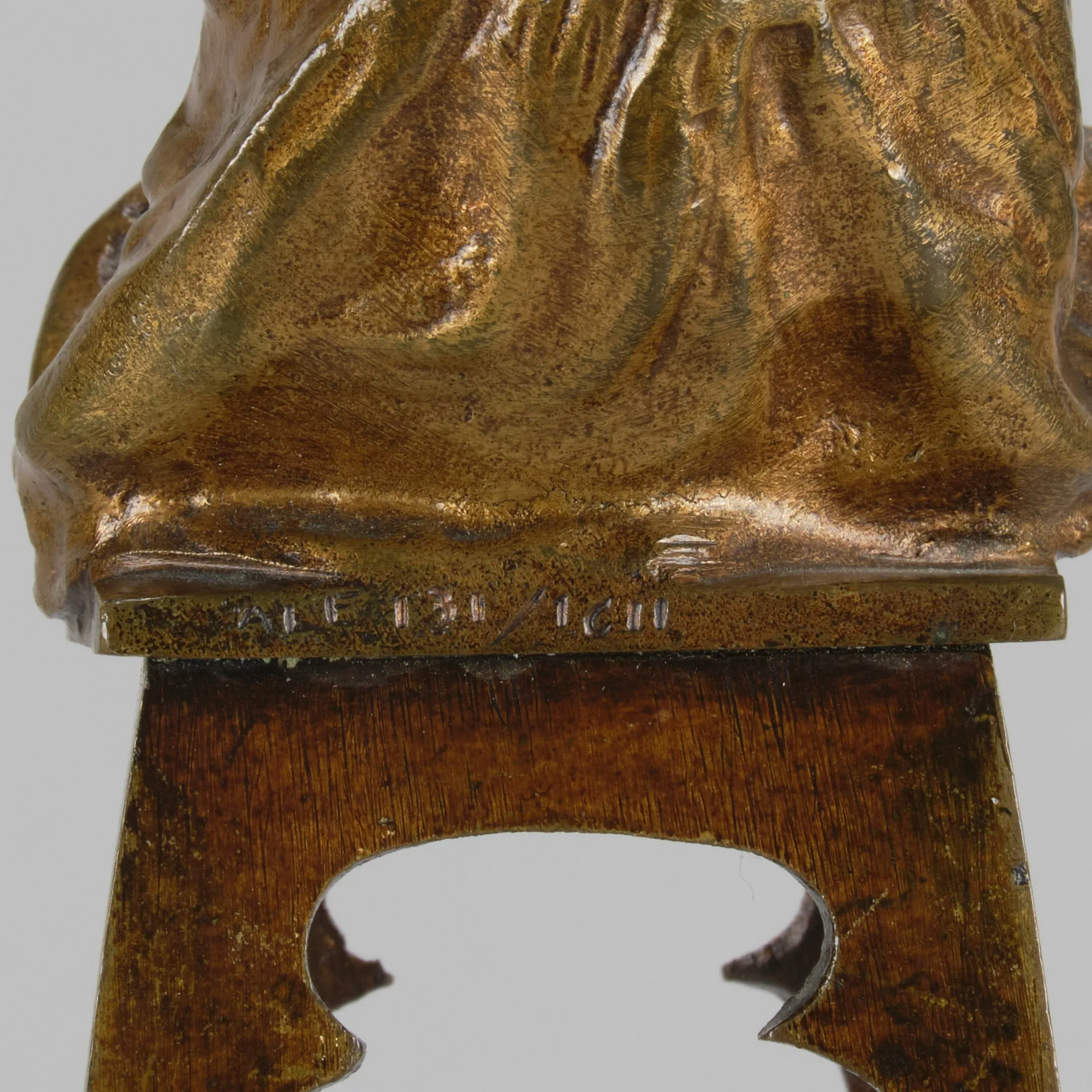 "Girl Putting on her Shoe" by Juan Clara